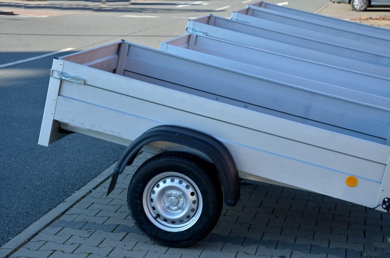 Silver Utility Trailer with One Visible Wheel — A1 Towing in Blue Haven, NSW