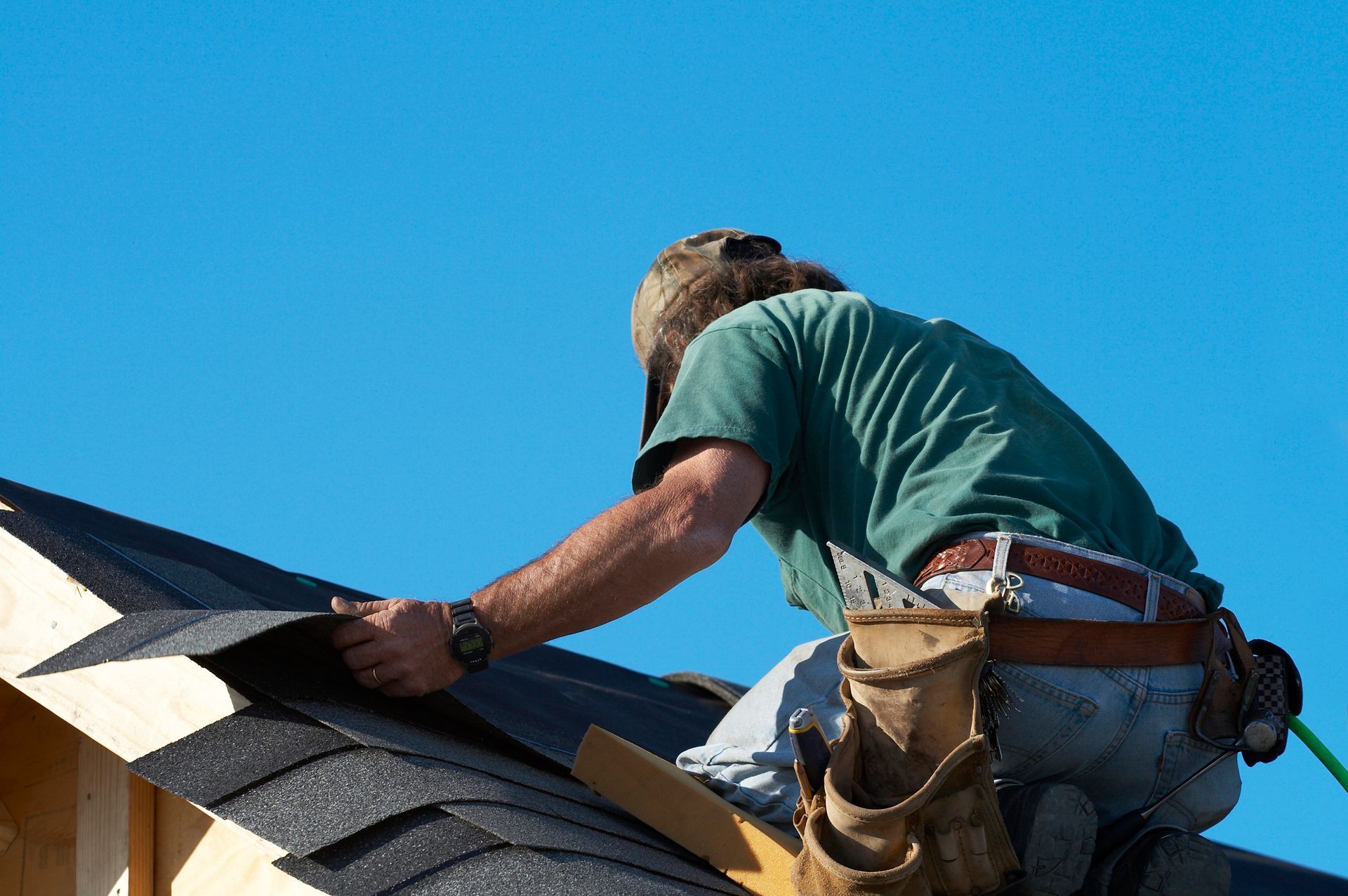 A builder working on a new roof installation for Meissen and Sons Roofing in Belton, MO A builder working on a new roof installation for Meissen and Sons Roofing in Belton, MO
