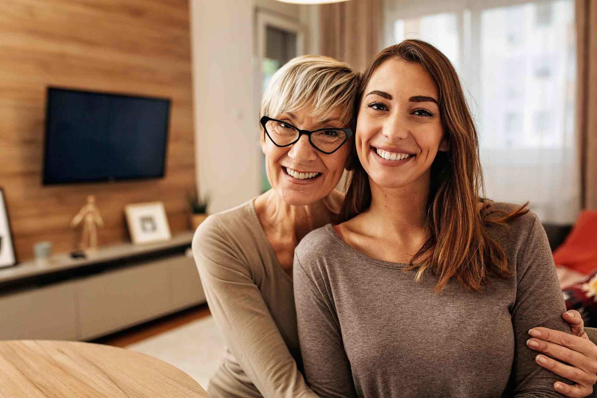 Mother Hugging Daughter — Forest City, NC — Green Insurance