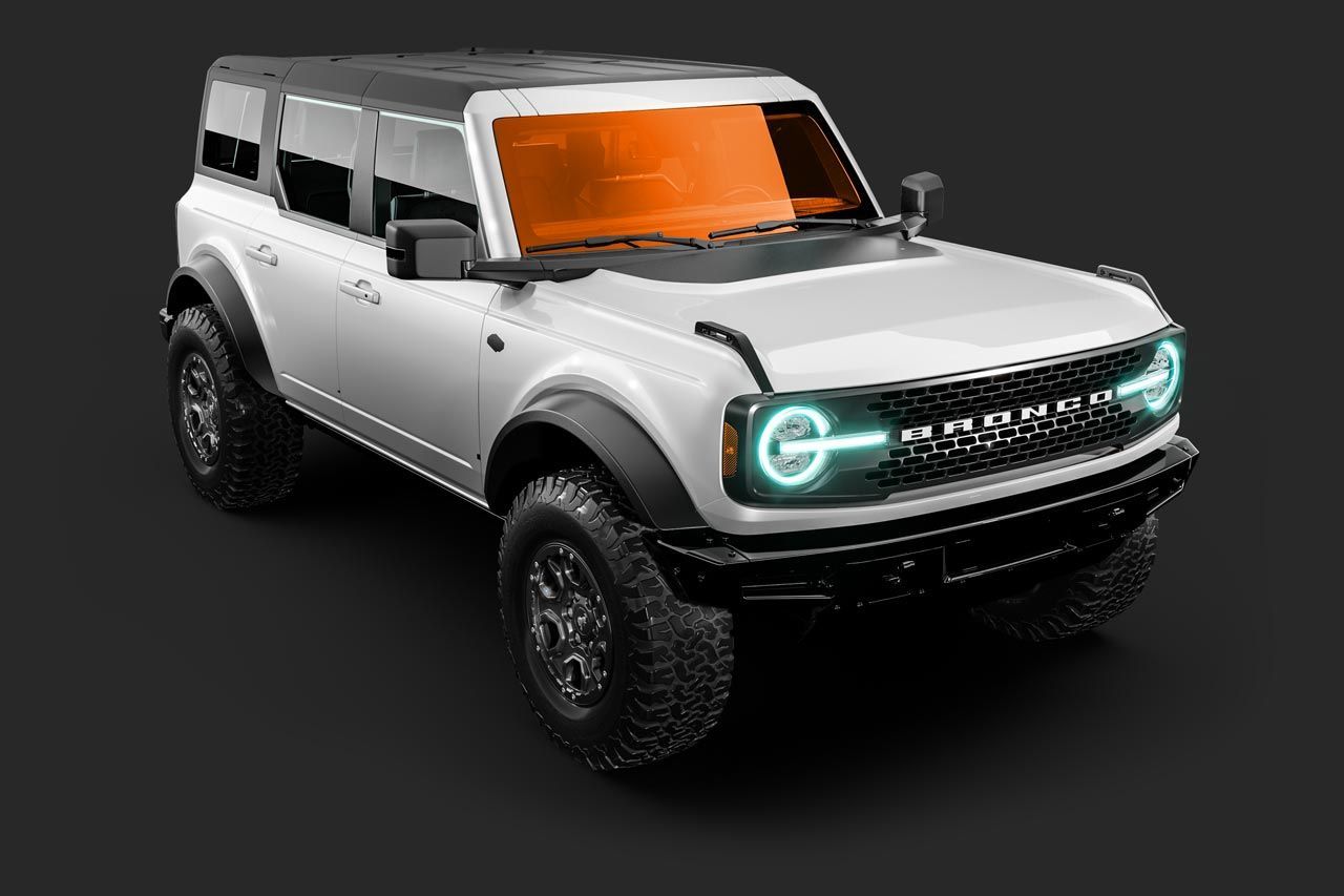 White Ford Bronco SUV with black accents on dark gray surface.