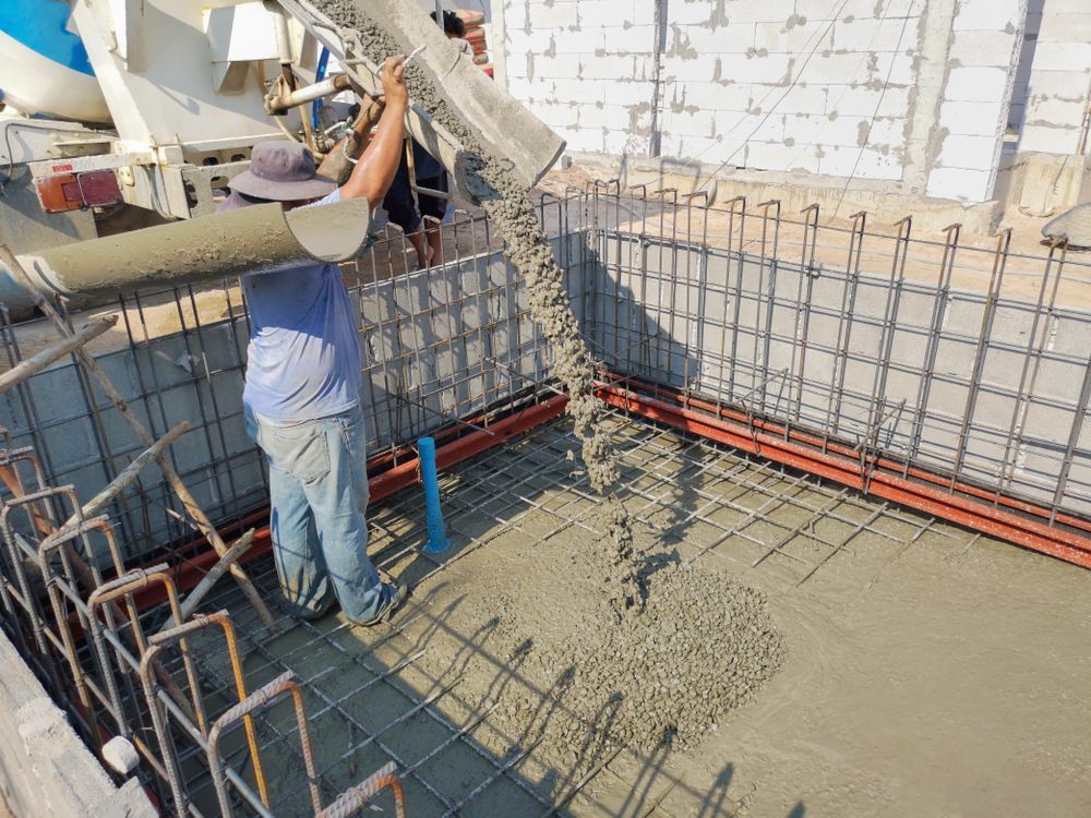 Construction Worker Pouring Concrete — Atherton Tableland Concreting in Herberton, QLD