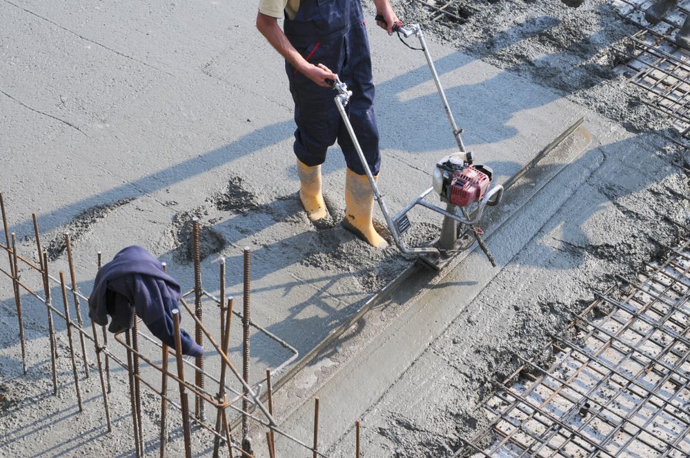 Construction Worker Smoothing Wet Concrete — Atherton Tableland Concreting in Peeramon, QLD