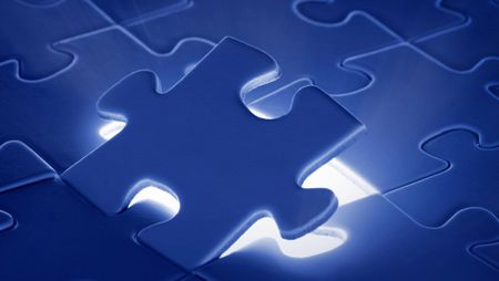 A blue puzzle with a light coming out of it.
