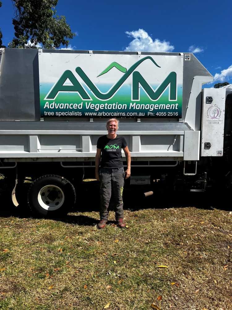 A Man is Standing in Front of a Dump Truck — Advanced Vegetation Management in Manoora, QLD