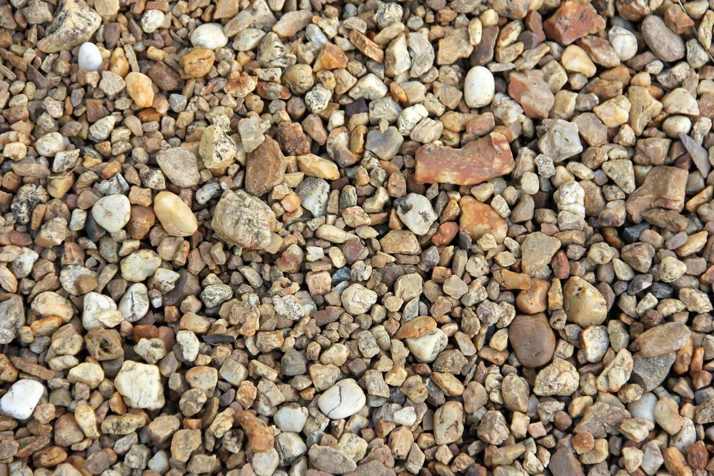 Gravels of Diffirent Shape and Sizes Lying on Ground — Dubbo Soils & Landscaping Supplies in Dubbo, NSW