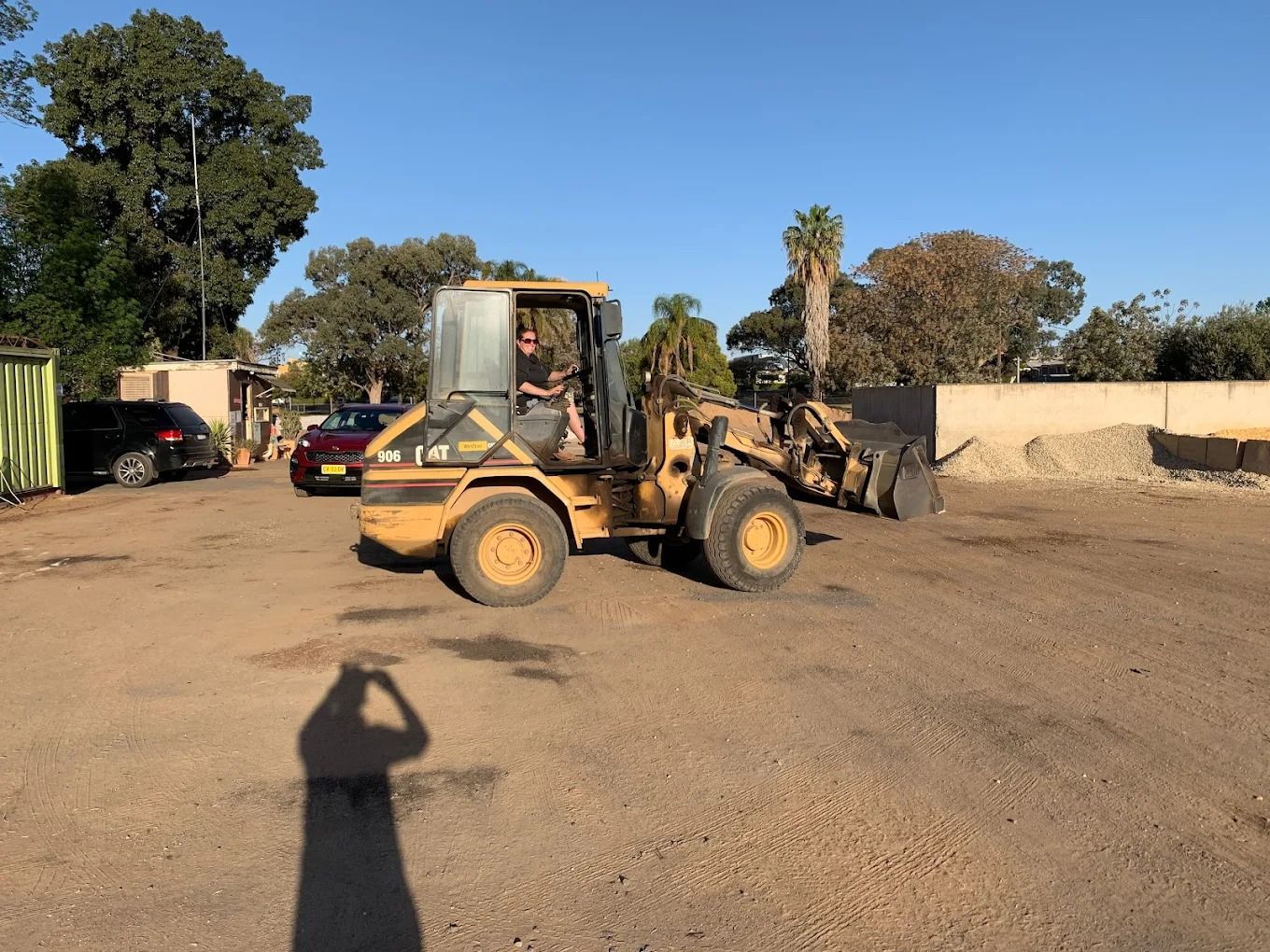 Hand Holding Soil With Some Roots — Dubbo Soils & Landscaping Supplies in Dubbo, NSW
