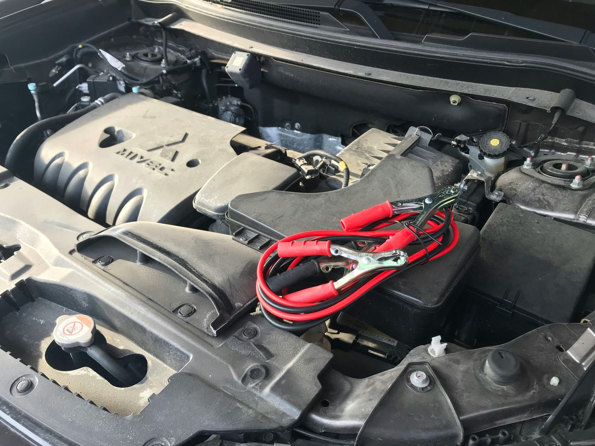 Automotive Engine Bay With Battery Cables Connected | Motiv Auto Care