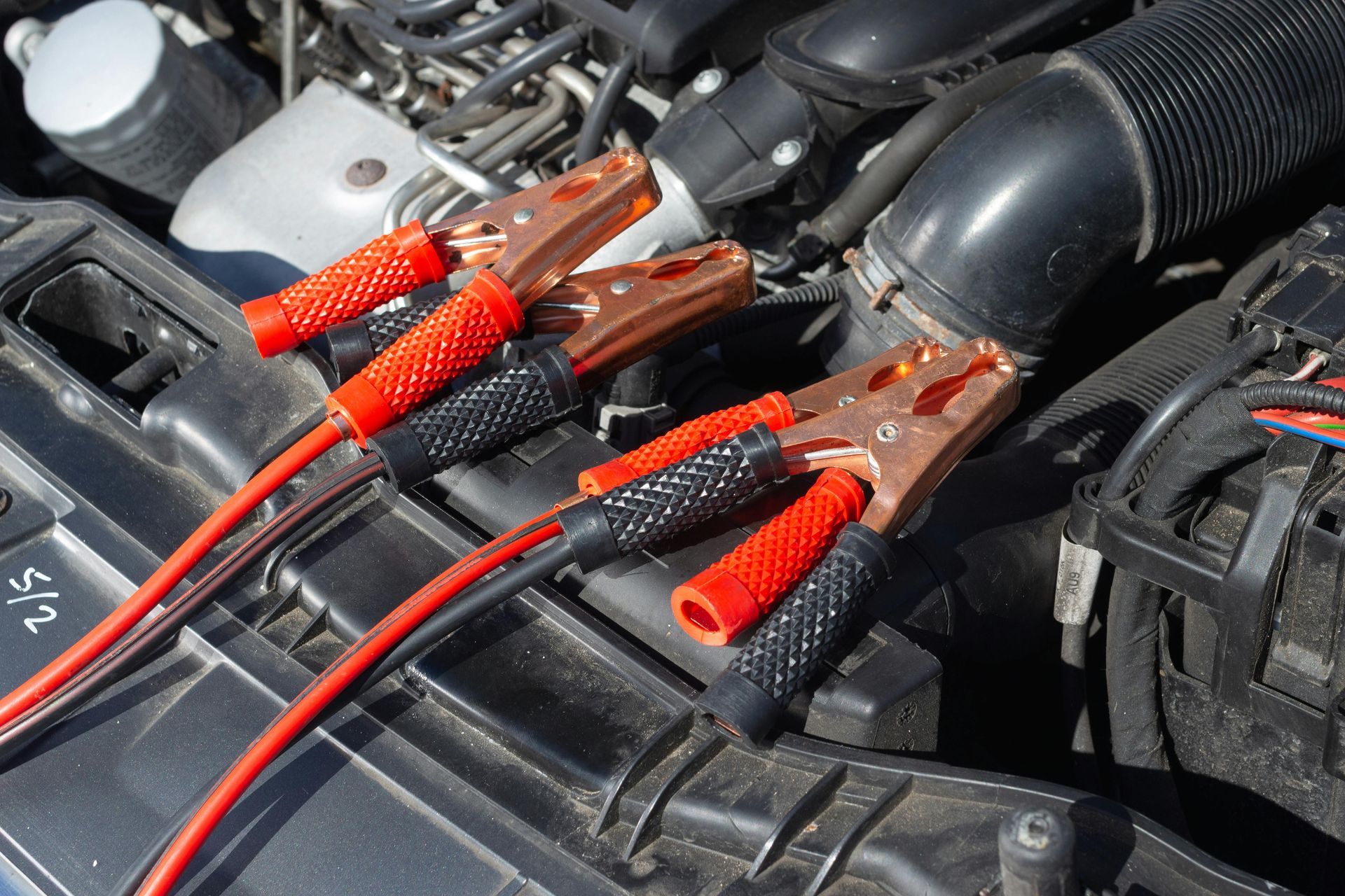 Car Battery Testing With Jumper Cables Attached | Motiv Auto Care