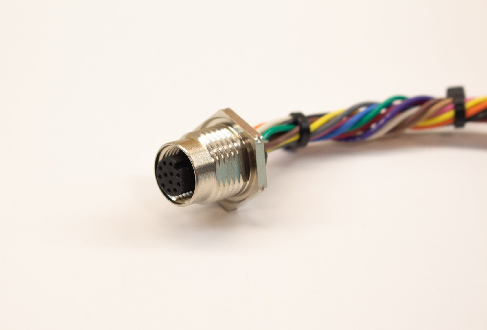 A close up of a connector with a bunch of wires attached to it