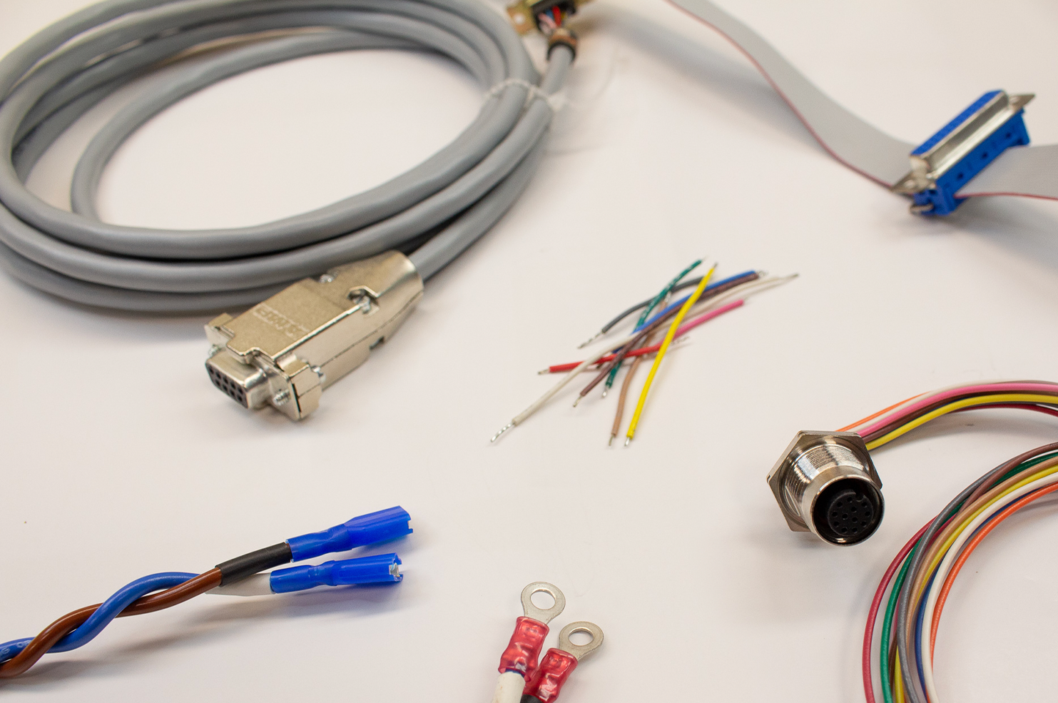 A bunch of wires and connectors on a white surface