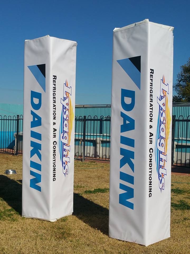 Two white pillars with daikin written on them — Mountain City Signs In West Tamworth, NSW