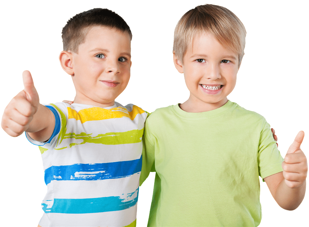 Two young boys are hugging and giving a thumbs up