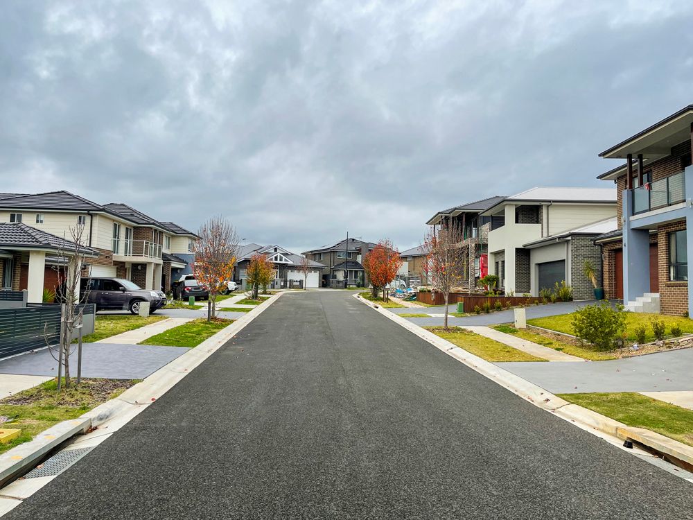 A row of houses along a street in a residential area on a cloudy day