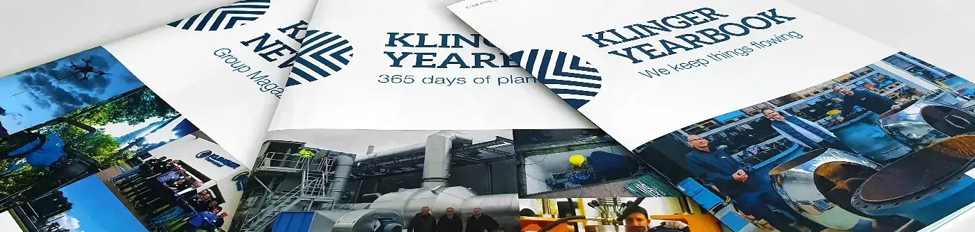 People holding KLINGERSIL cut gaskets