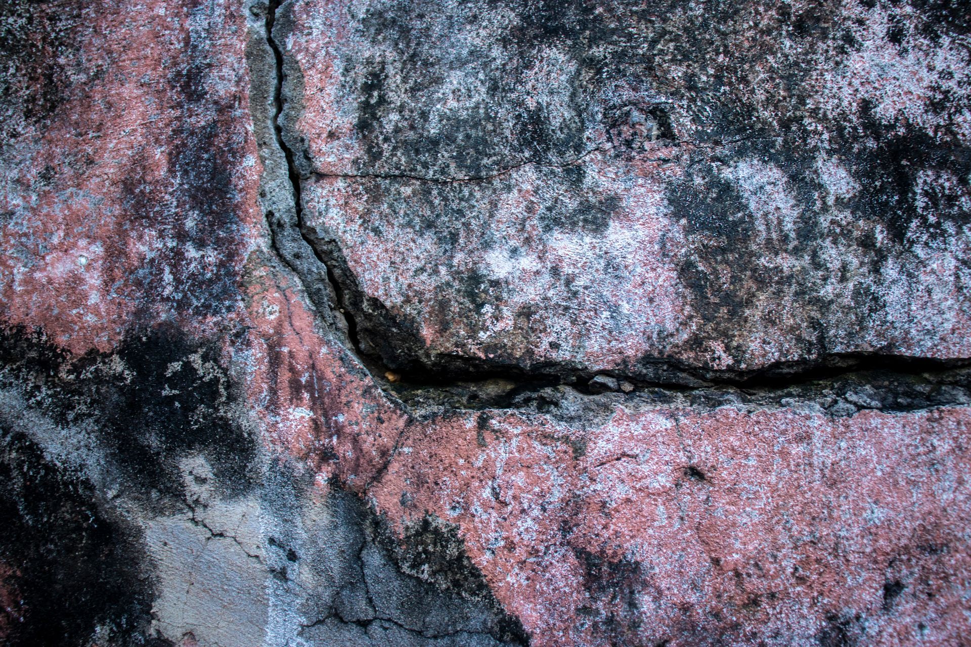 Close-up view of a crack of a commercial wall full of asbestos Close-up view of a crack of a commercial wall full of asbestos