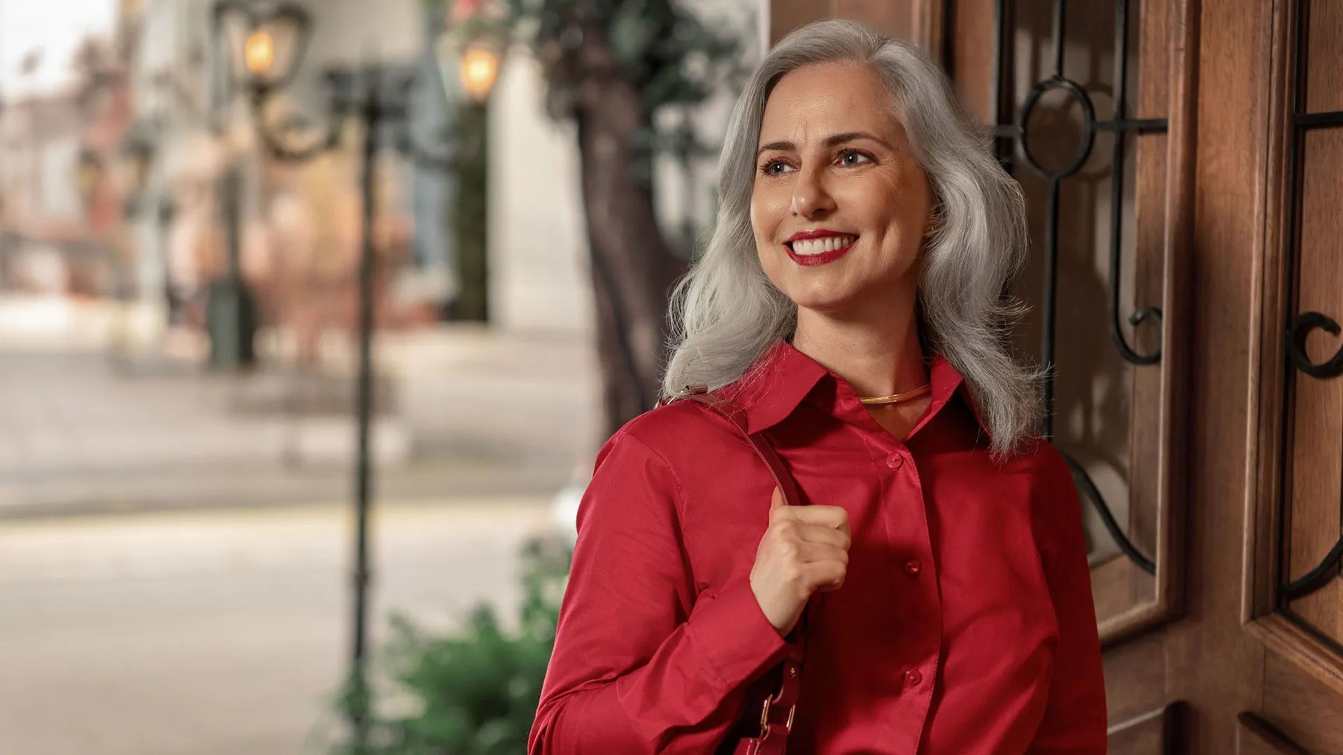 Confident person wearing a Signia MaX hearing aid outdoors