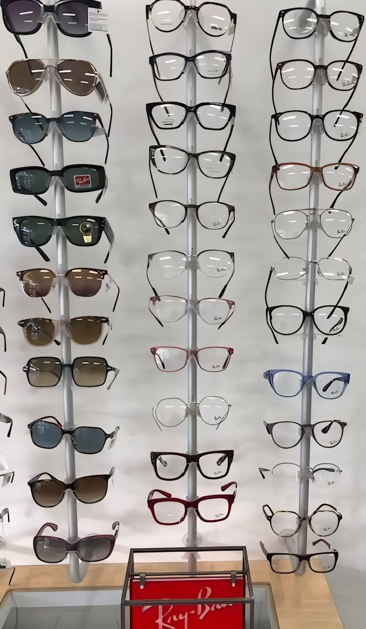 A Bunch of Glasses Are Hanging on A Rack in An Optical Shop — New Look Eyewear In Maitland, NSW