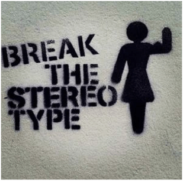 Black stencil graffiti saying “BREAK THE STEREO TYPE” beside a stick figure raising a hand
