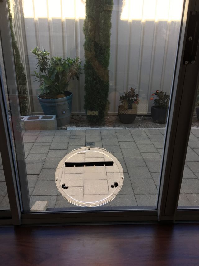 A Sliding Glass Door With A Dog Door In It – Adelaide, SA - Sola Bloc Window Tinting