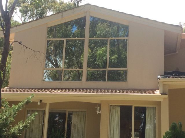 A Large House With A Lot Of Windows And A Roof – Adelaide, SA - Sola Bloc Window Tinting