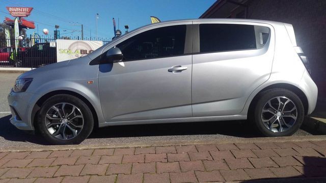 A Silver Car Is Parked On A Brick Sidewalk – Adelaide, SA - Sola Bloc Window Tinting