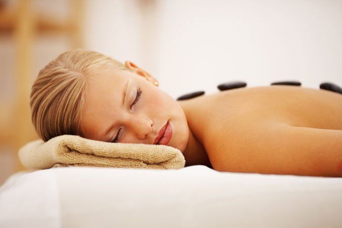 lady having hot stone massage