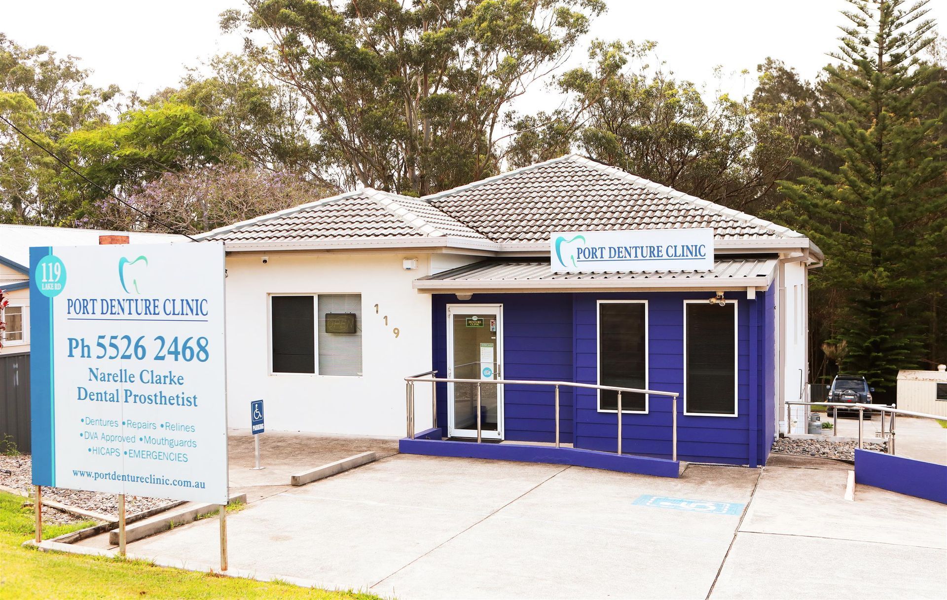 A Nurse Is Hugging An Older Woman Who Is Wearing Glasses — Port Denture Clinic In Bonny Hills, NSW