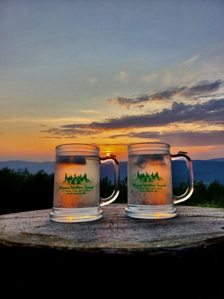 Two mugs featuring the logo for 