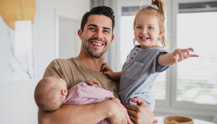 A new father on paternity leave cherishing memories with his kids