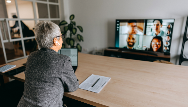 Business manager enjoys the benefits of a hybrid work model as they meet with their team online