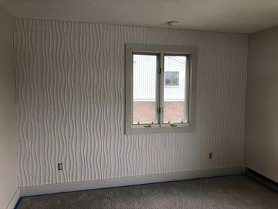There is a window in the middle of the room.