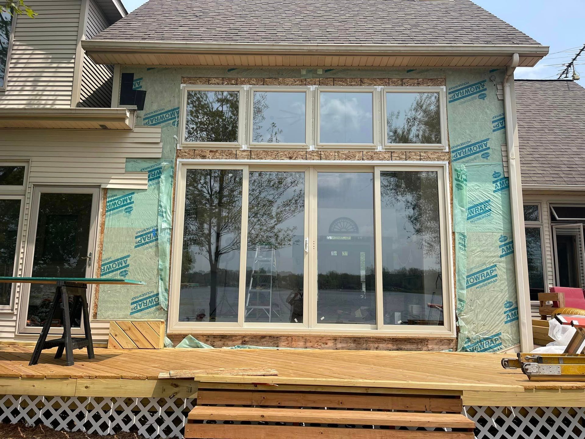 A house with a lot of windows is being remodeled.