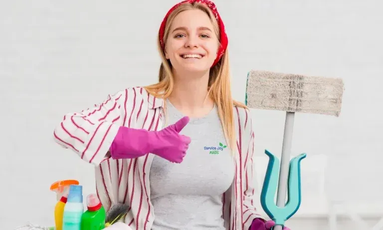 Smiling cleaner with gloves and spray bottles holding a mop in a bright cleaning scene
