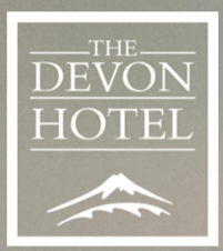 A logo for the devon hotel with a mountain on it