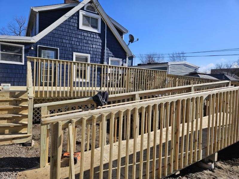 Carpenter on a wooden roof frame, hammering. Bright sunlight. Carpenter on a wooden roof frame, hammering. Bright sunlight.