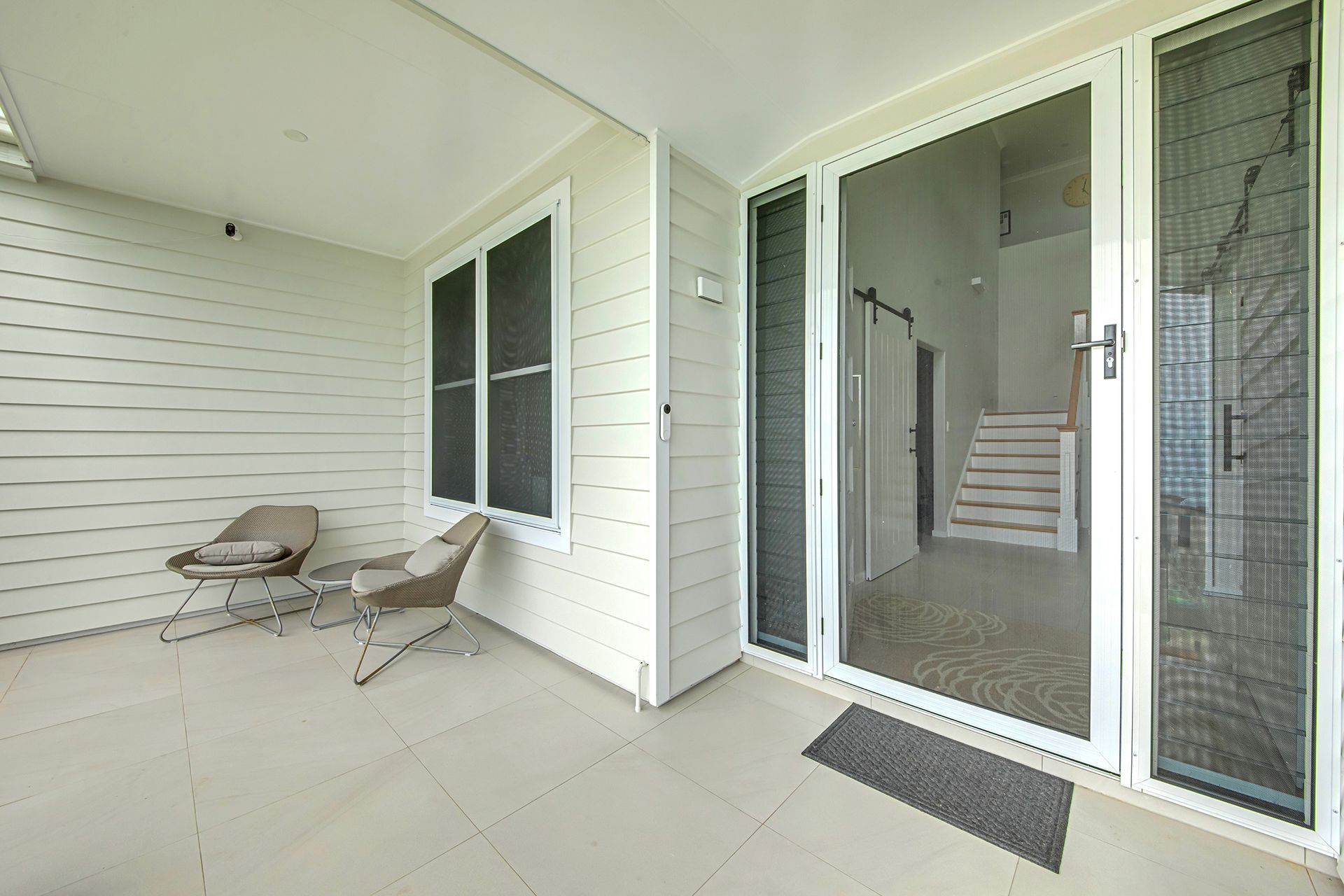 Patio With Two Chairs, Two Windows, and Screen Door — Wares Blinds, Screens & Awnings In Boyne Island, QLD