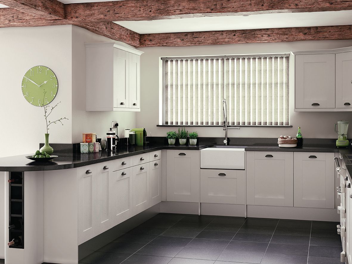 White kitchen with black countertops, wood beams, and vertical blinds Wares Blinds, Screens & Awnings In Gladstone Central, QLD