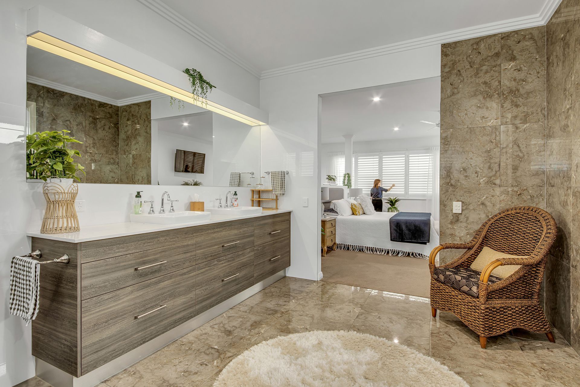 Bathroom with Vanity, Large Mirror, Brown Stone Tile, and A View Into a Bedroom — Wares Blinds, Screens & Awnings In Yeppoon, QLD