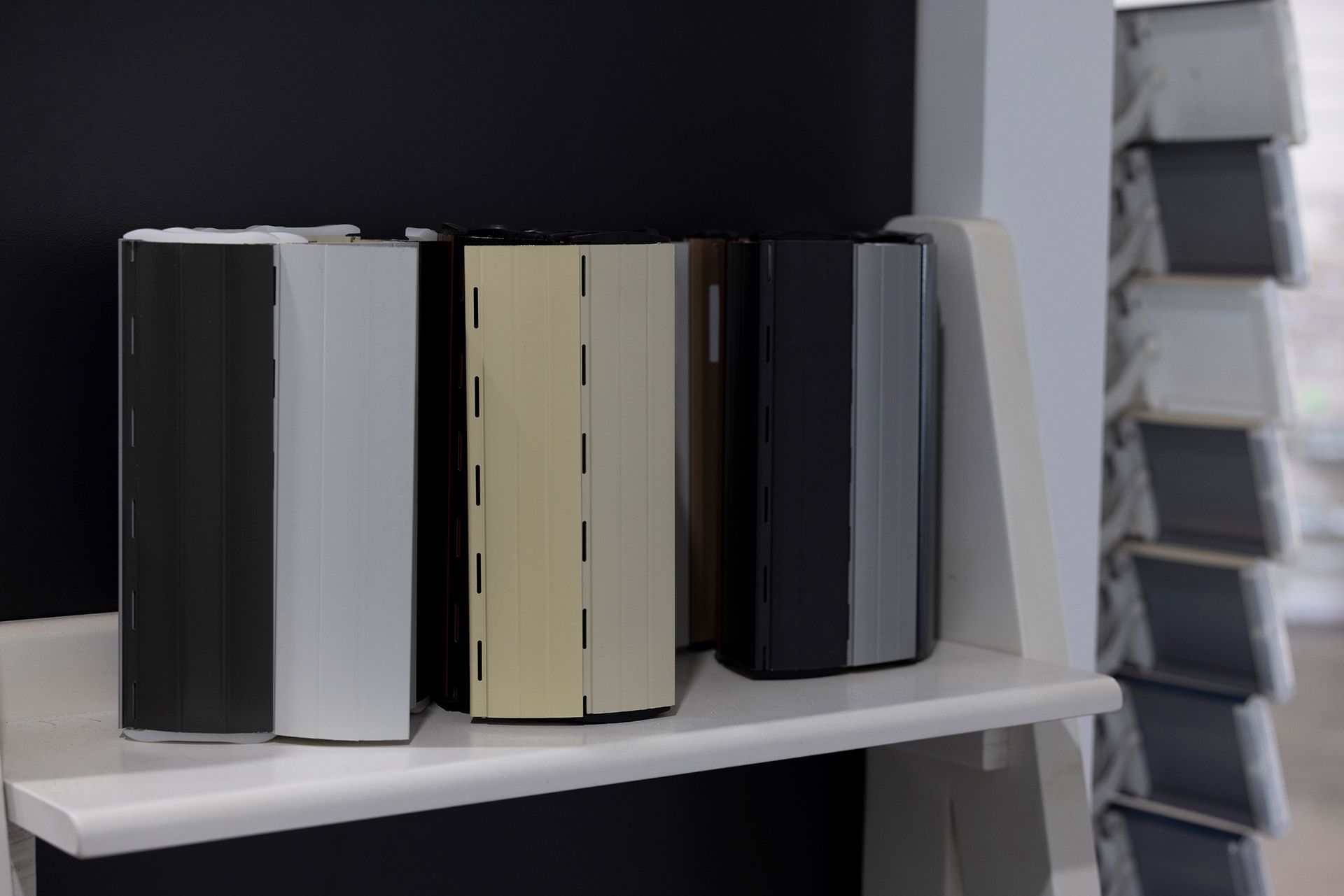 Five Hexagonal Columns in Various Colors on a White Shelf — Wares Blinds, Screens & Awnings In Gladstone Central, QLD