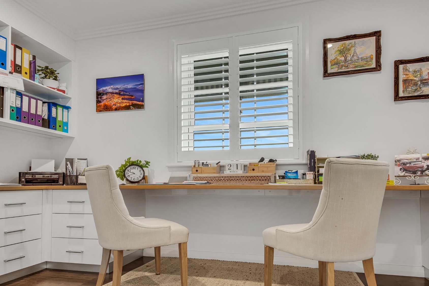 Home Office with Two Chairs Facing a Desk in Front of A Window with Shutters — Wares Blinds, Screens & Awnings In Gladstone Central, QLD