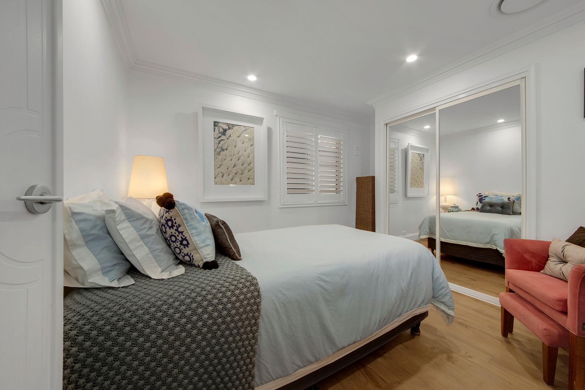 Bedroom With Bed, Closet, and Chair — Wares Blinds, Screens & Awnings In Tannum Sands, QLD