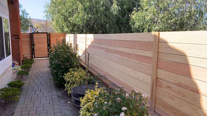 vinyl white fence in backyard