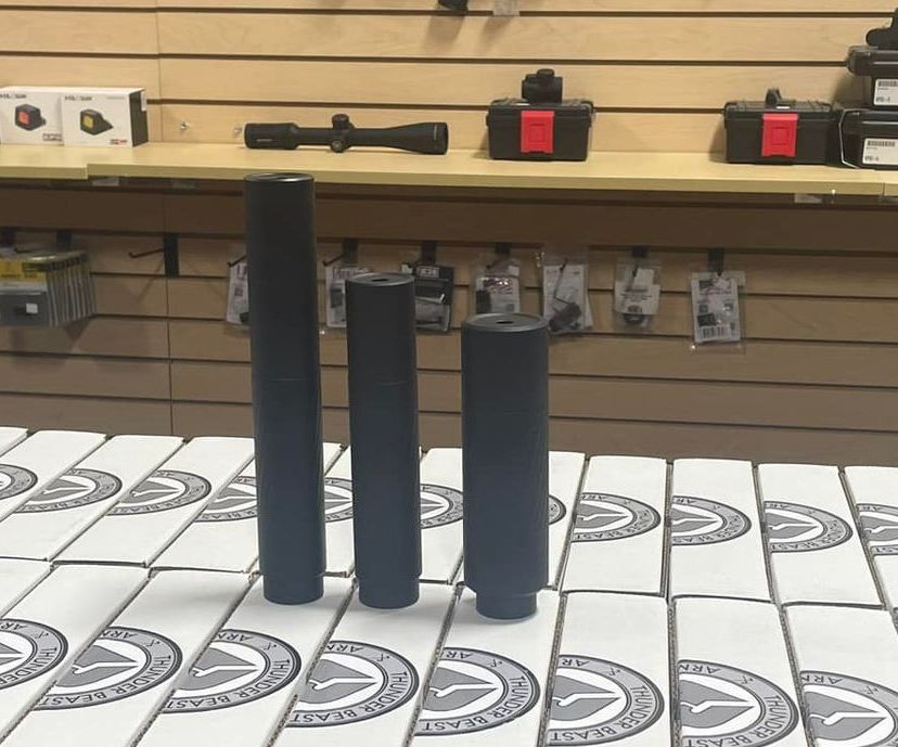 Three black tubes are sitting on a table in a store