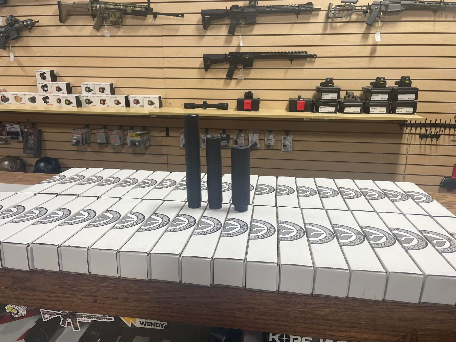 A bunch of boxes are sitting on a table in a store.