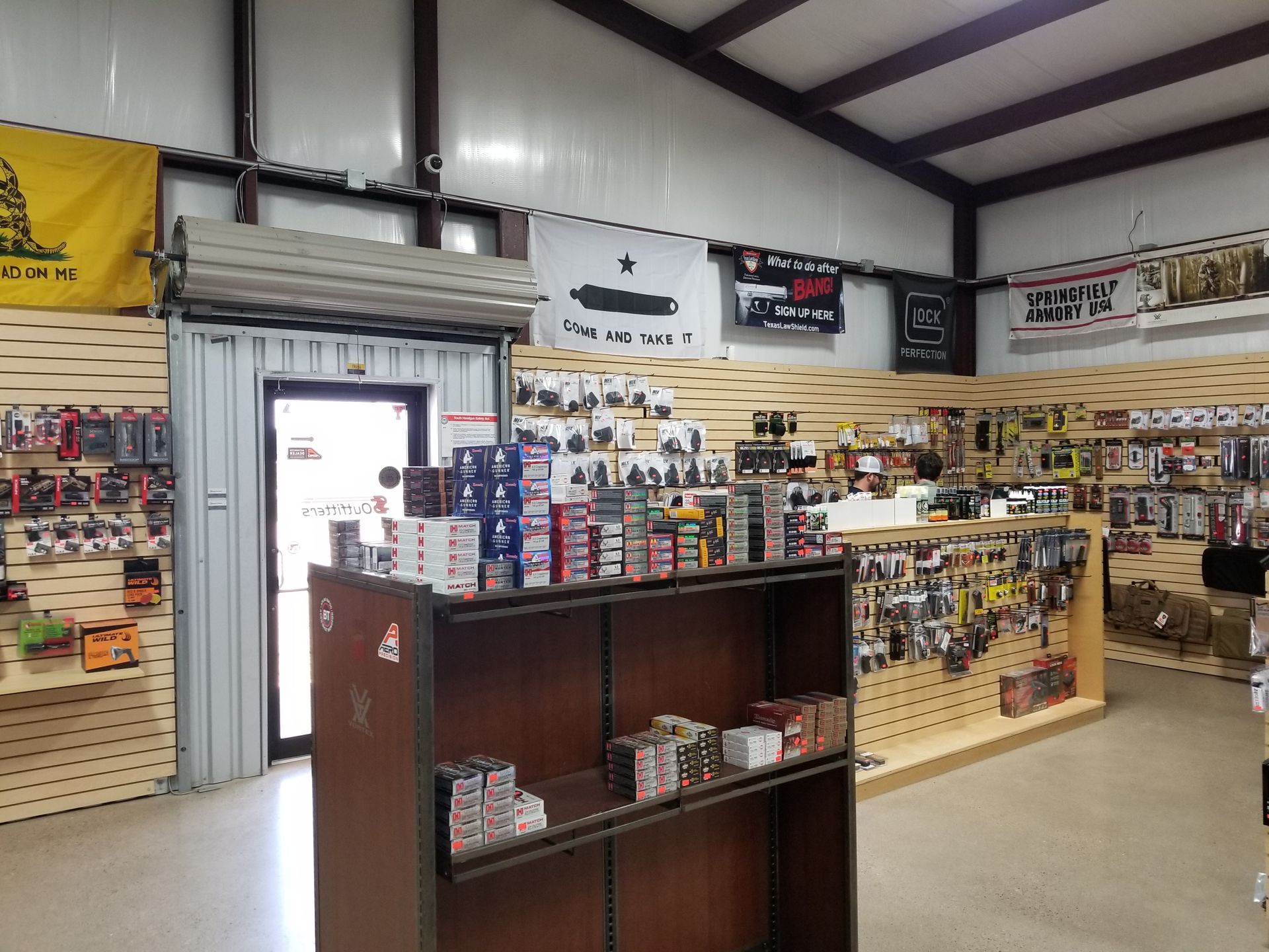 A store filled with lots of items and a yellow flag that says liberty