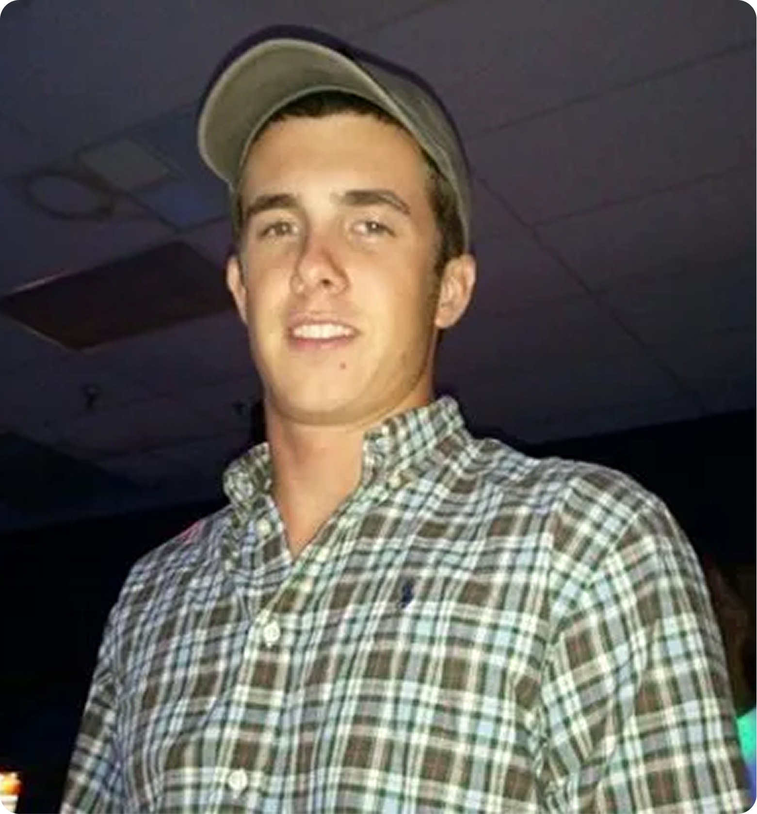 Young man wearing a plaid shirt