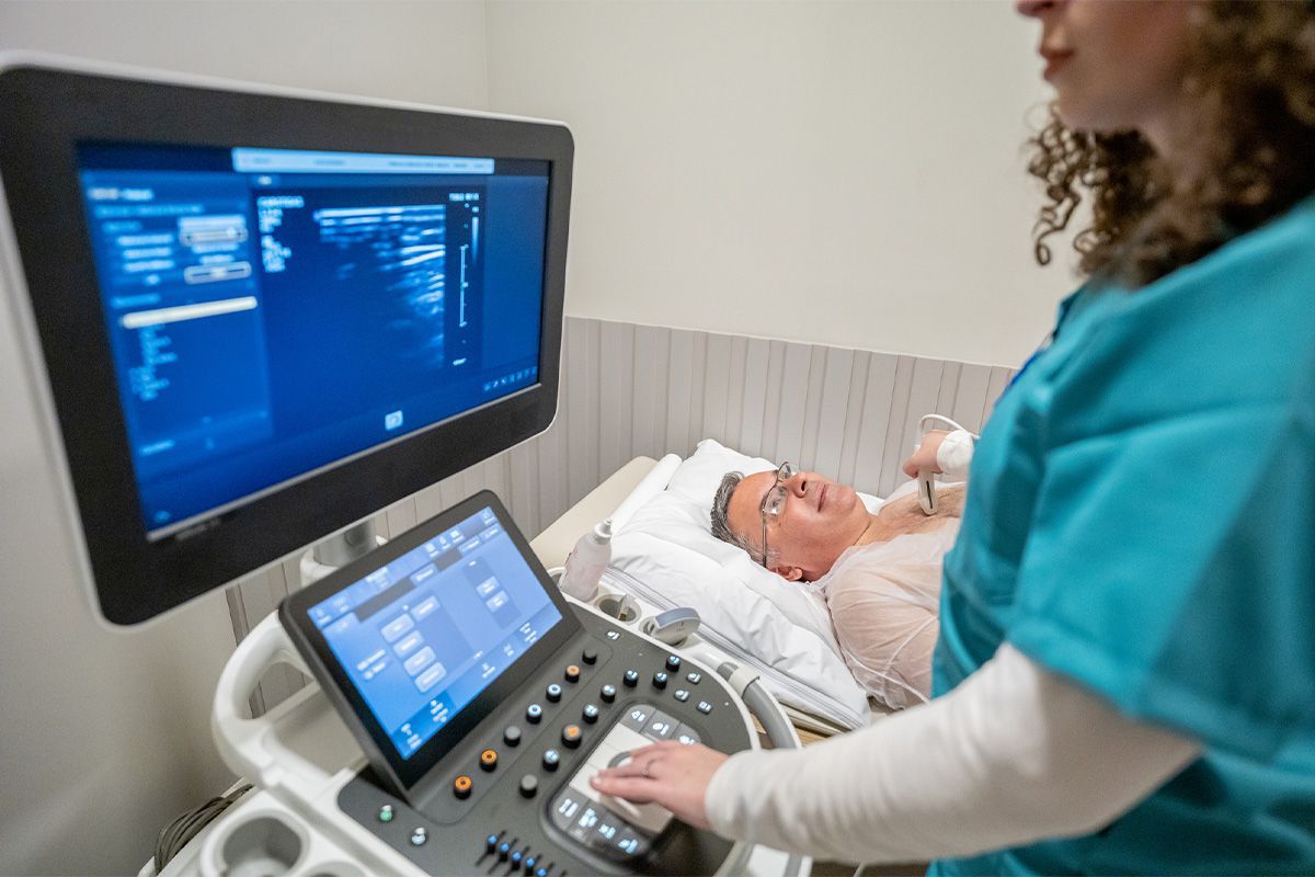 Patient speaking with the doctor about heart scan results.