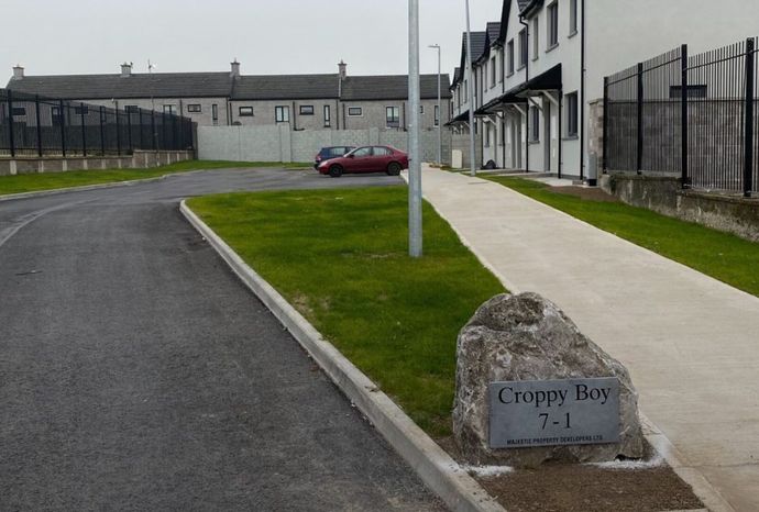 A sign on the sidewalk says croppy boy 7-1