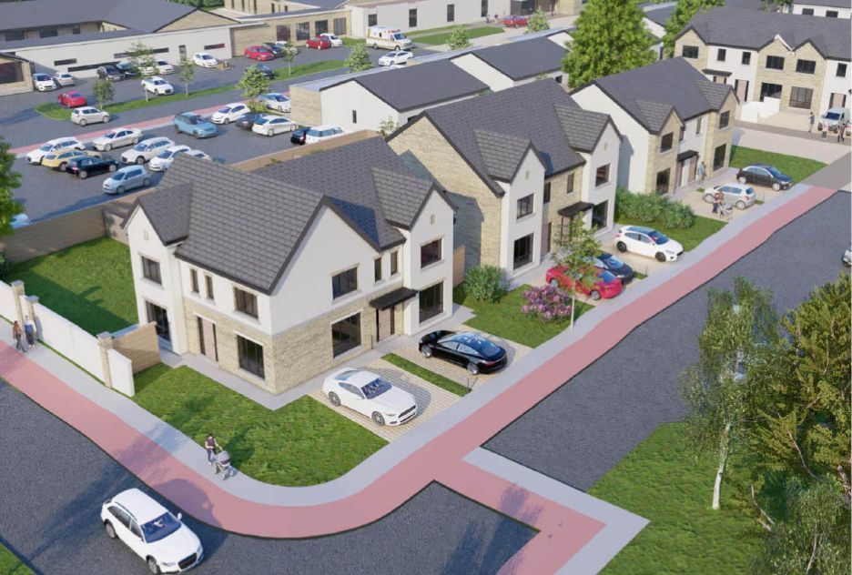 An aerial view of a row of houses with cars parked in front of them.