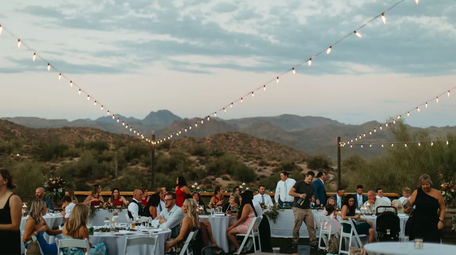 Event venue in Cave Creek with people set up at tables.